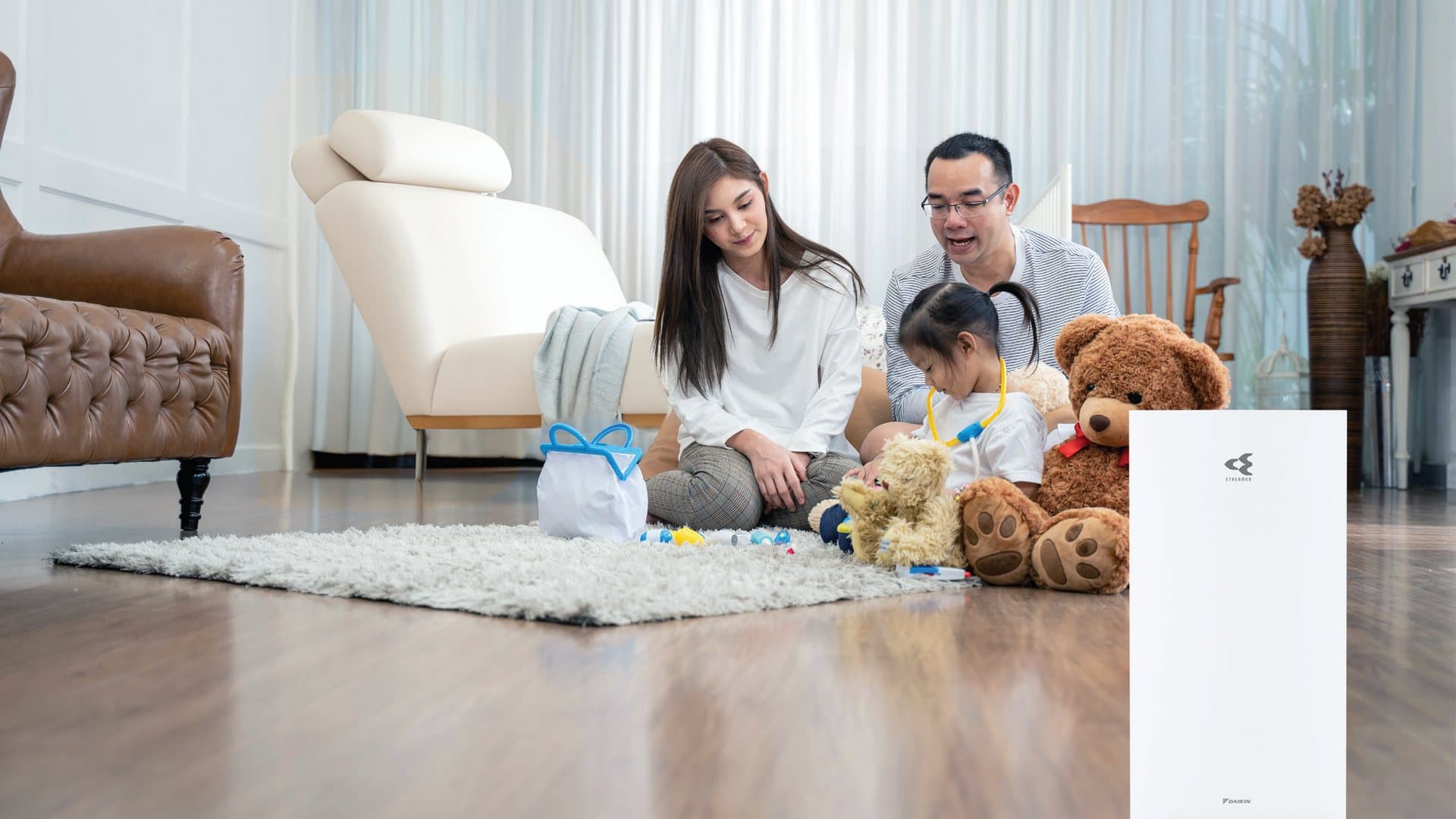 Daikin MC80ZVMM air purifier in a family room, from Daikin's brochure.