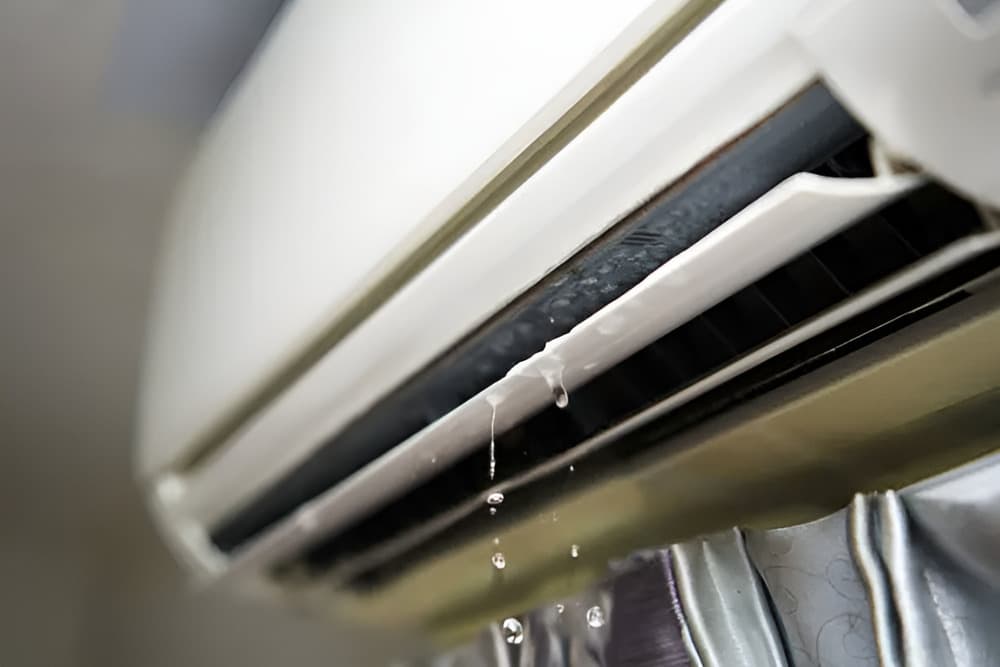 Aircon leaking water from the front is caused by a clogged condensate drain line