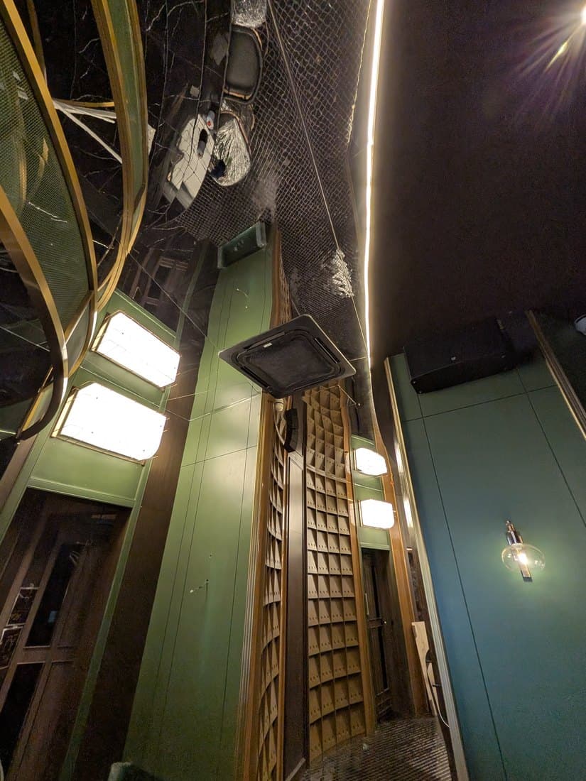 A ceiling cassette in a panelled bay with concealed cove lighting running the length of the ceiling.