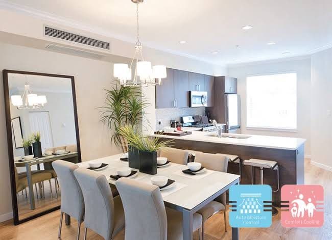A dining room with a slim ceiling unit.
