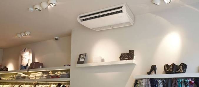 A Daikin ceiling-suspended unit mounted below the slab in a retail store.