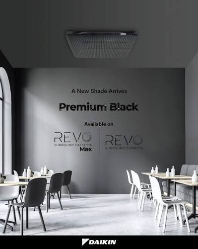 Daikin's Premium Black REVO cassette shown in a café interior.