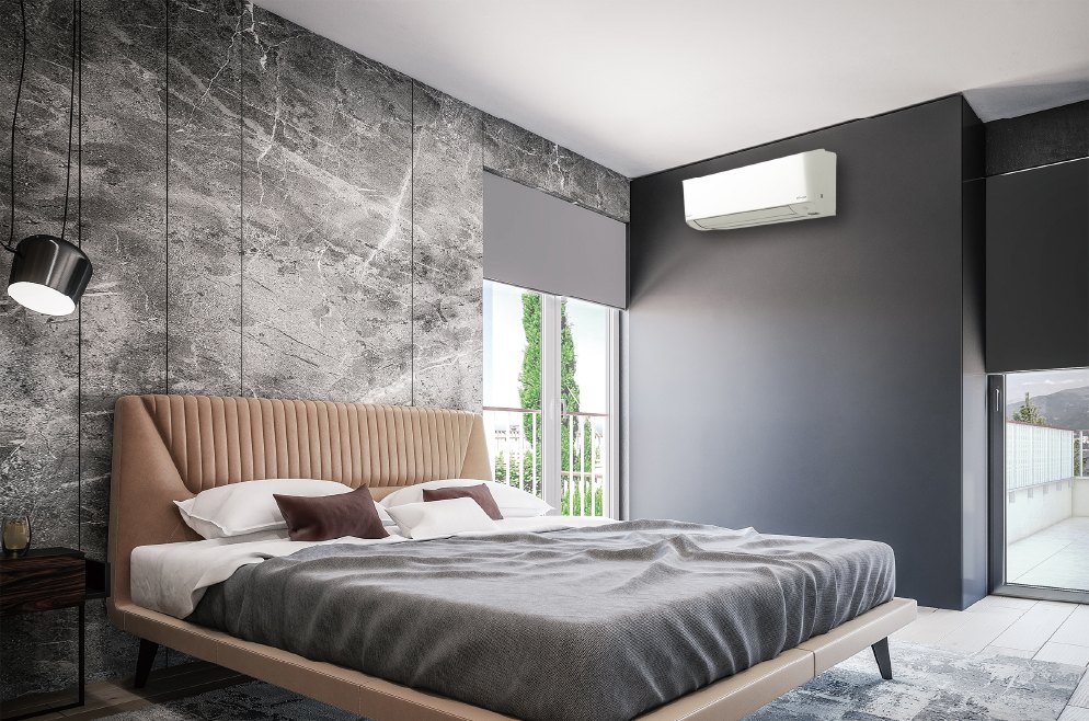A Daikin wall-mounted unit installed above the window in a bedroom.